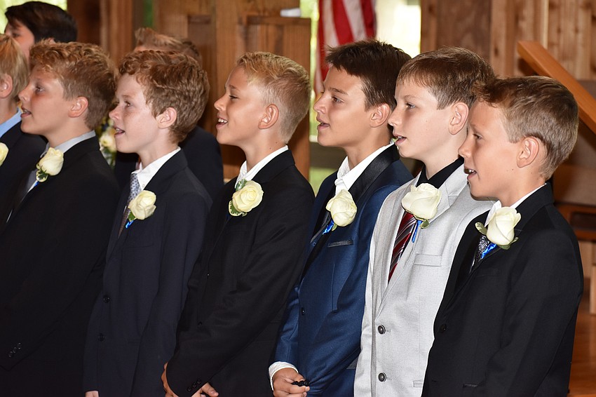 Graduating fifth graders sing “Happiness” at the Out-of-Door Academy Lower School Graduation on June 2 at Siesta Key Chapel.
