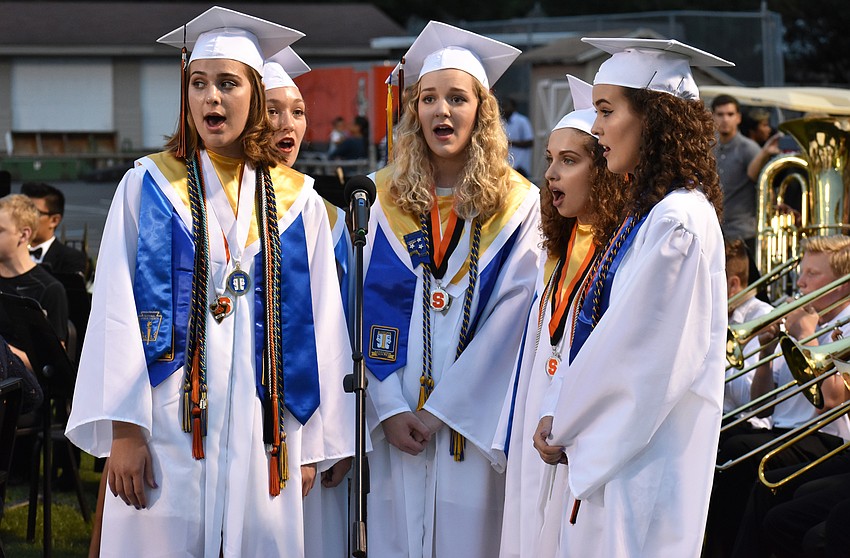 Students perform at the start of the Sarasota High School graduation ceremony at Cleland Stadium at Ihrig Field.