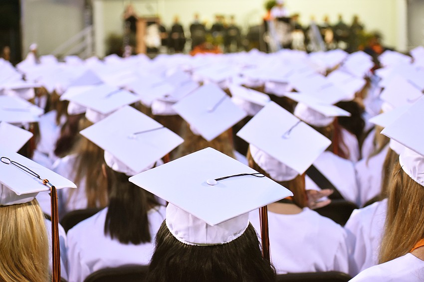 Students listen to student speeches during Sarasota High School graduation at Cleland Stadium at Ihrig Field.