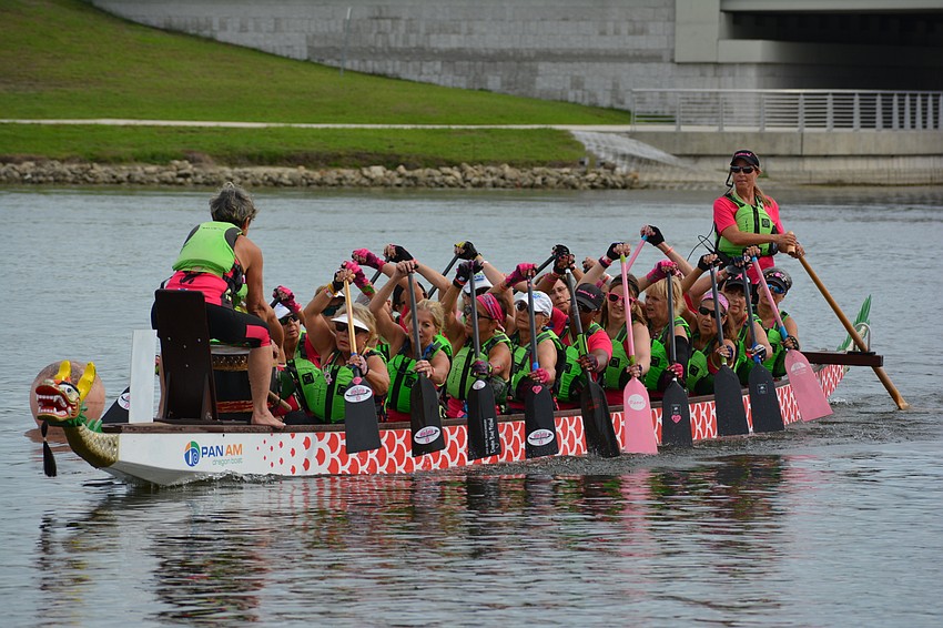 Although tired after the race, Survivors in Sync stays in sync as the paddlers return to the dock.