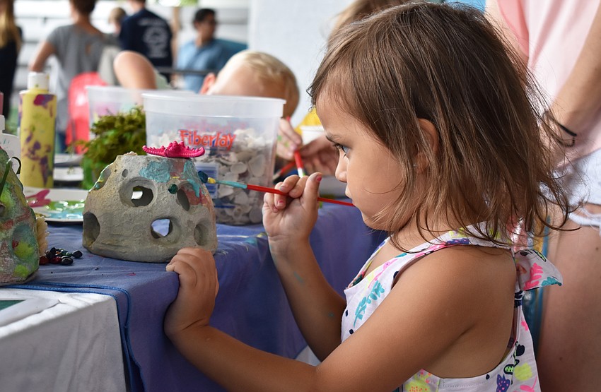 Kierra Hutson focuses on her painting at World Oceans Day on June 3 at Mote Aquarium.