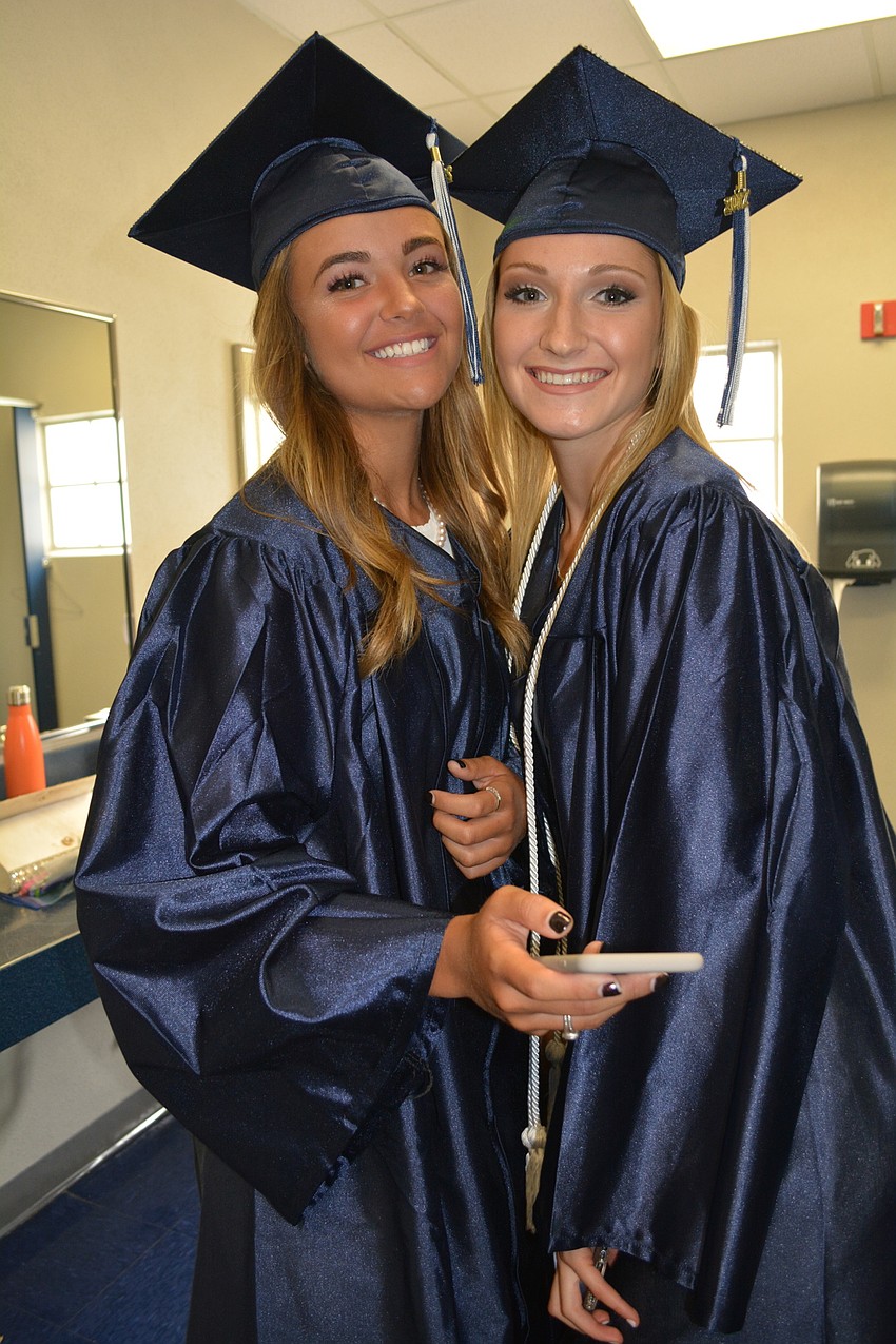 Sasha Brun-Wibaux and Chloe Ruppert check out the photo they just posted on Snapchat.