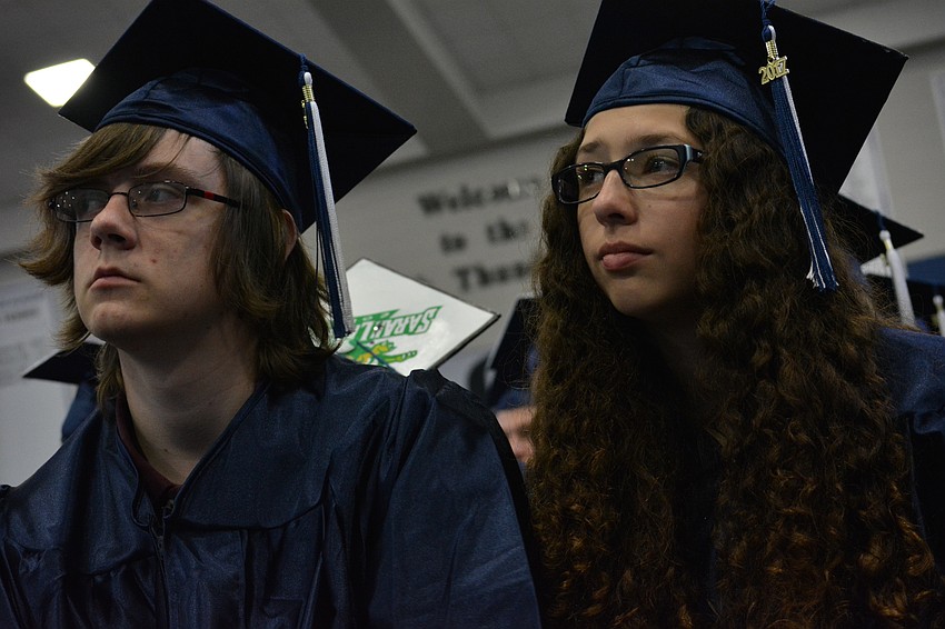 Tristan Bleau and Quinn Birmingham watch the ceremony.