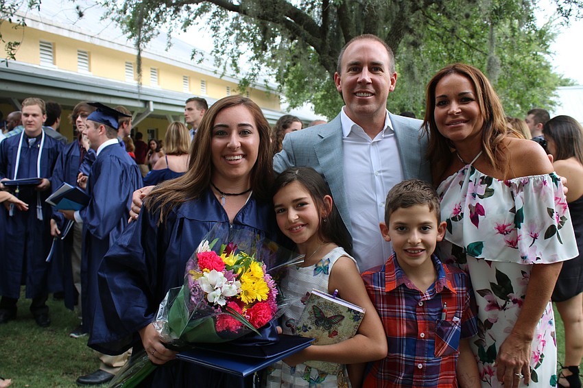 Madison Reece celebrates graduation with her family, parents  Alex and Nadia (behind) and siblings Rachel and Nicholas, front. Courtesy photo.
