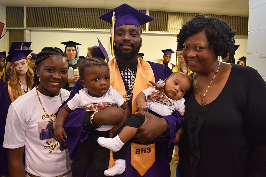 Tamiyah Mitchell, Tory Mitchell Jr. (holding Tory Mitchell III and Jaievon Mitchell) and Lisa Mitchell