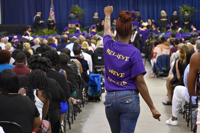 A spectator celebrates the class of 2017 during the Booker High School Graduation on June 3 at Robarts Arena.