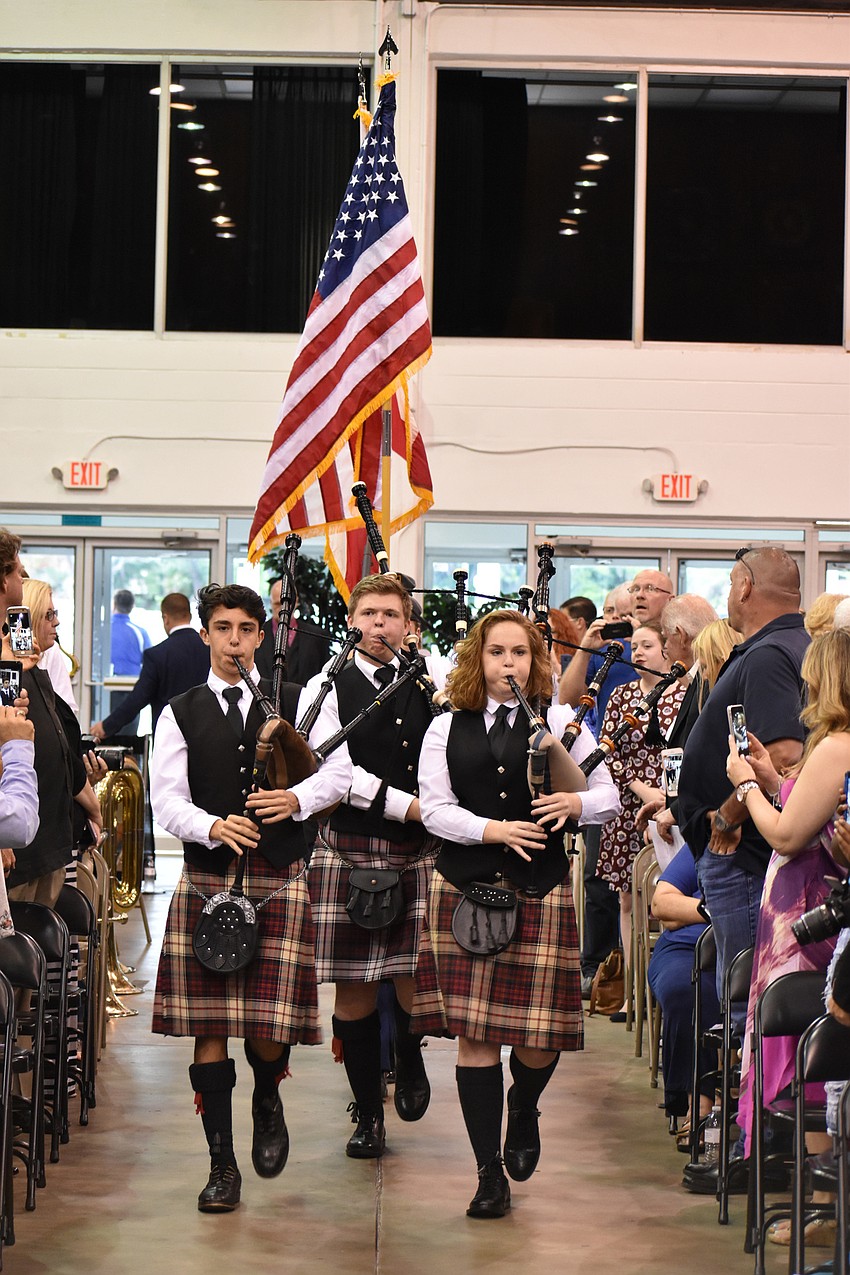 The RHS Kiltie Pipers perform as they make their way to the stage for the presentation of the colors and national anthem during the Riverview High School Commencement Ceremony on June 3 at Robarts Arena.
