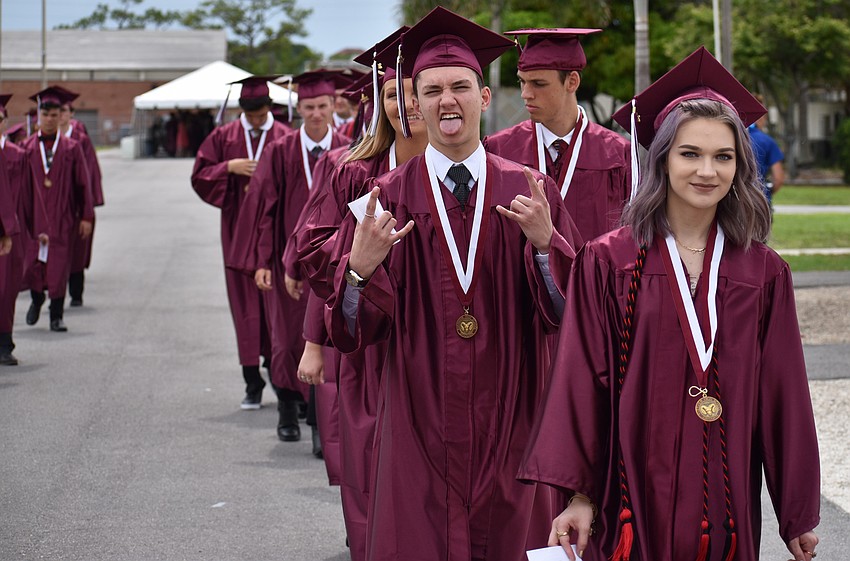Students walk to the arena in line for the processional during the Riverview High School Commencement Ceremony on June 3 at Robarts Arena.