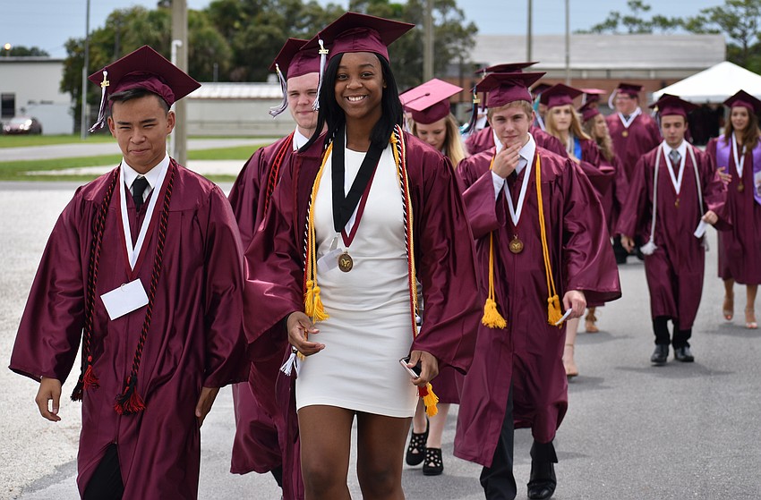 Students walk to the arena in line for the processional during the Riverview High School Commencement Ceremony on June 3 at Robarts Arena.