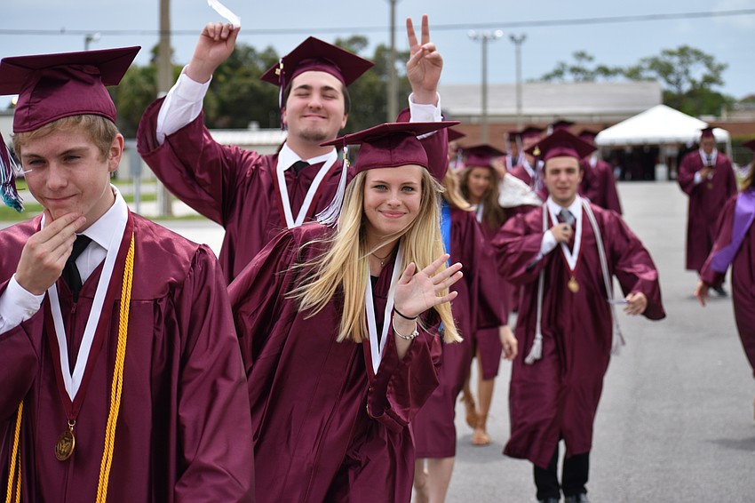 Students walk to the arena in line for the processional during the Riverview High School Commencement Ceremony on June 3 at Robarts Arena.