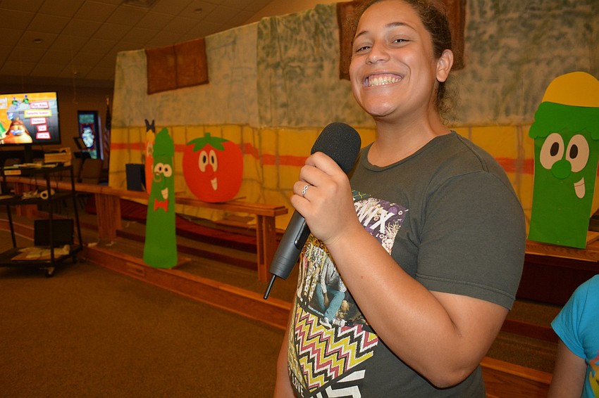 Waterlefe'   s Sami Copeland, 16, leads children in the closing activities for the day.