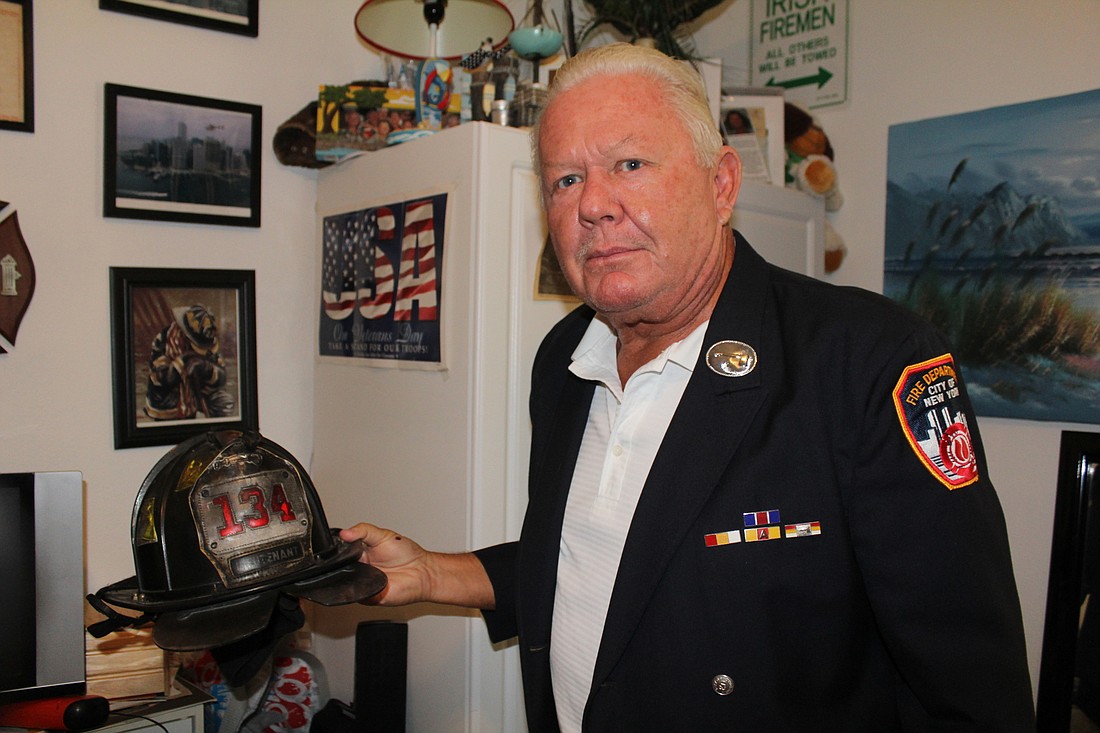 University Park&#39;s Gerard McParland puts on his fireman gear as he reflects on September 11, 2001.