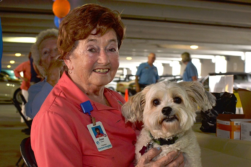 June Faunce poses with T-Bear during the  Doctors Hospital of Sarasota's carnival benefiting the Southeastern Guide Dogs.