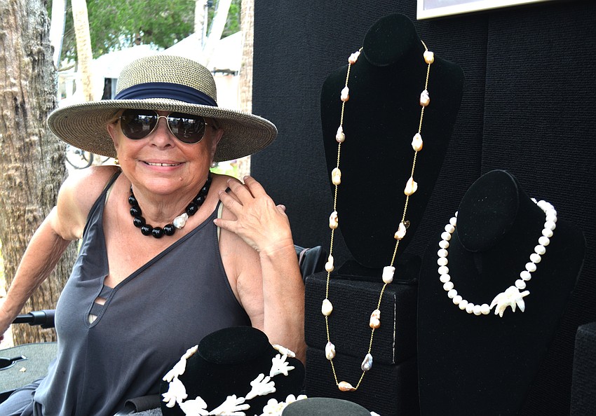 Finny Lazarus poses next to her jewelry.