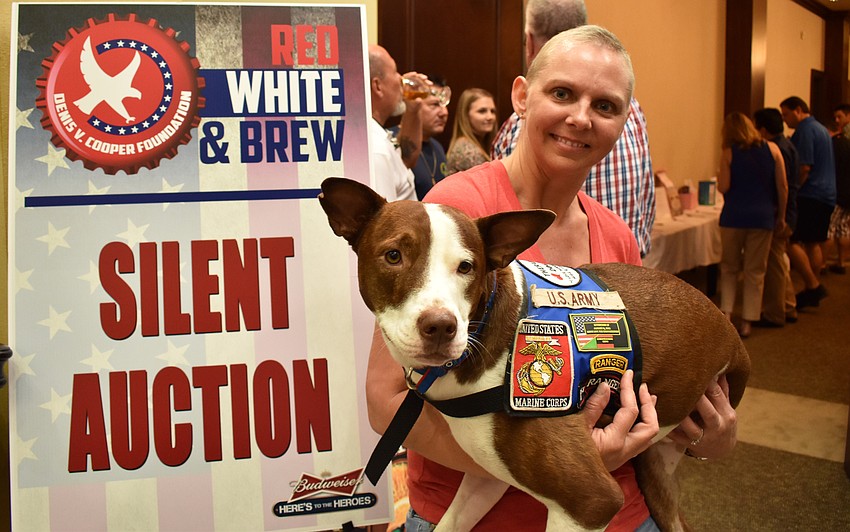LaVonne Bower with therapy dog Oz from the Paws And Warriors program