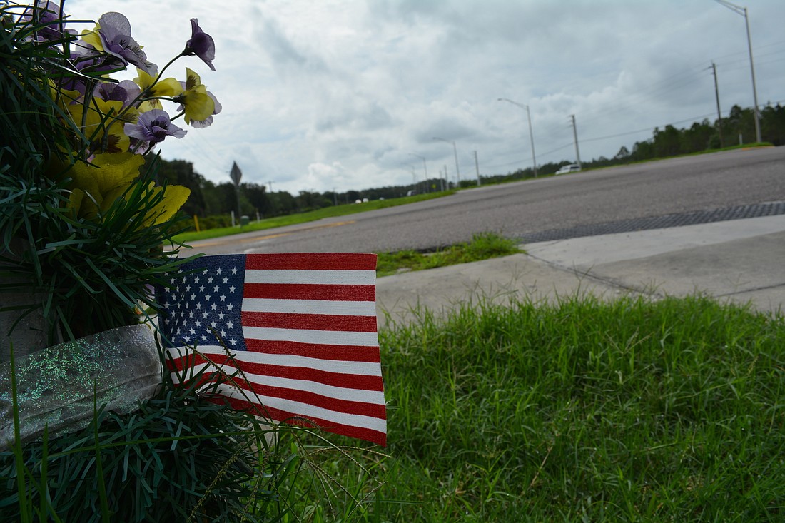 A marker at the entrance to GreyHawk Landing, on State Road 64, pays tribute to the late John Frye, a resident who died on a foggy morning in February 2016 while trying to cross State Road 64 at the intersection.