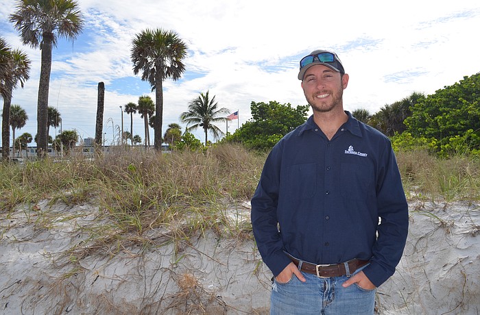 County parks employee Ryan Murphy is working with Lido residents to raise public awareness regarding the importance of the dunes.