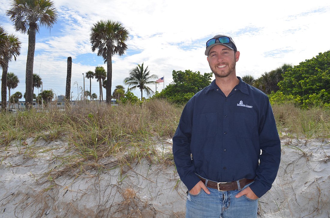 County parks employee Ryan Murphy is working with Lido residents to raise public awareness regarding the importance of the dunes.