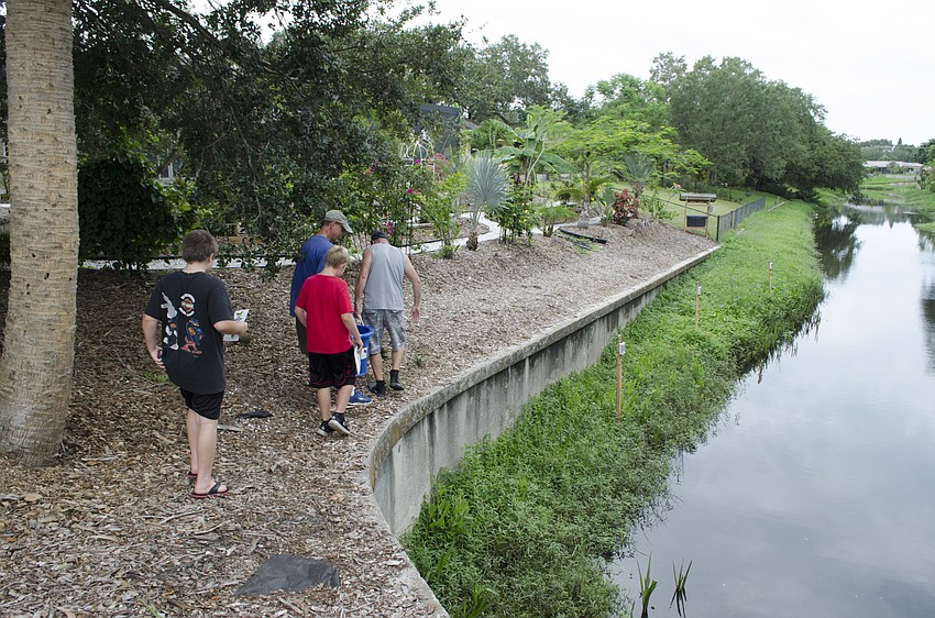 The children follow scientists out on the side of the creek, eager for a front row seat to the release.