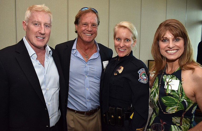 Dave Smith, Craig Holiday, Officer Lori Jaress and Lisa Holiday