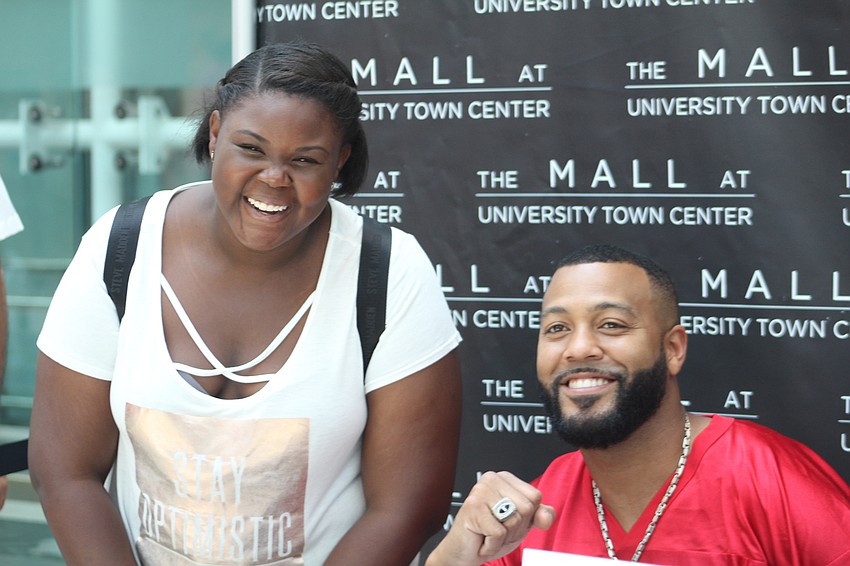 Bradenton's Jabrielle Nelson and  former Bucs wide receiver Michael Clayton meet for the first time during Dad's Day.