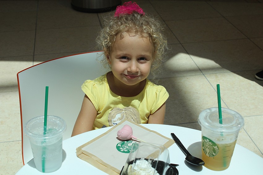 Palmer Ranch's Yana Bendersky enjoys not one, but two Starbuck's refreshments.