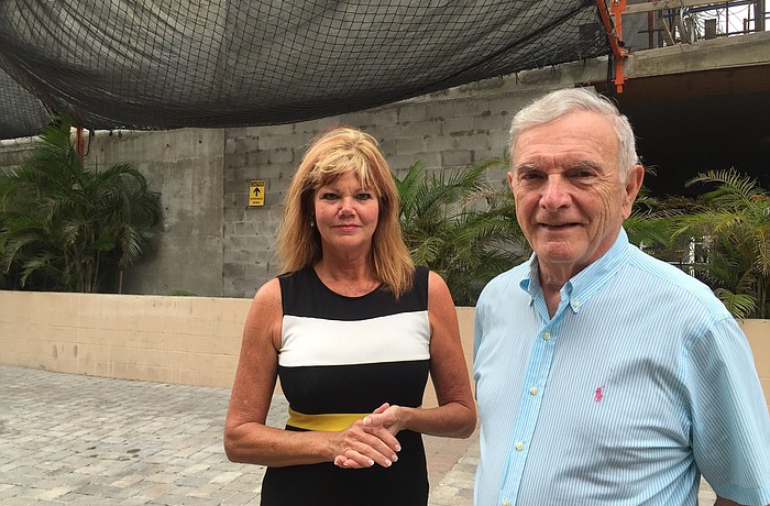 Even after the builder put up netting, Cindy Lang and Lottie Varano are asking the city to do more to protect the Essex House property from the effects of the neighboring construction site.