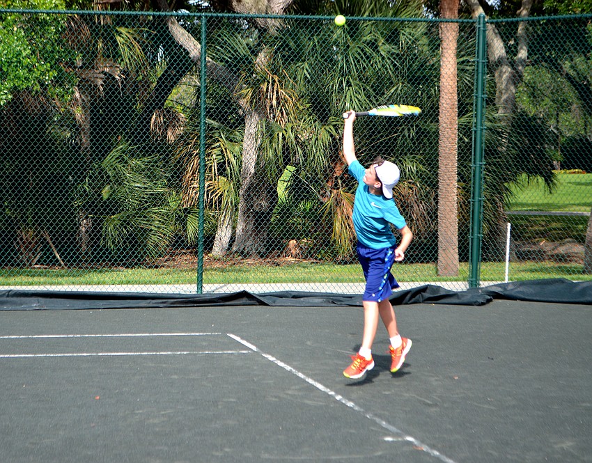 Alex Burducea serves the ball during a camp match on June 21.