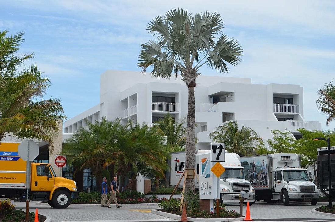 Workers put the finishing touches on the Zota Beach Resort on Longboat Key on Wednesday.