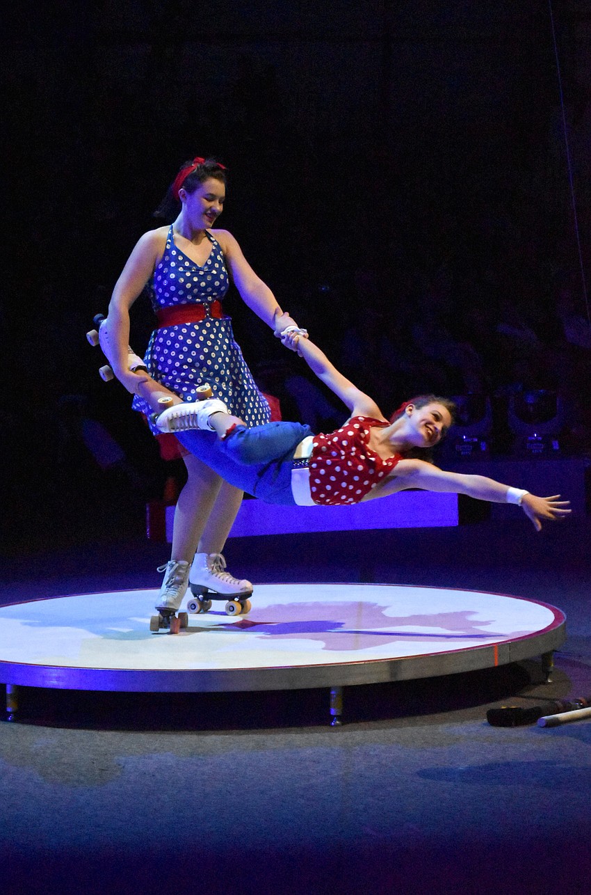 Riley Board and Rylee Roulette perform an Acrobatic Roller Skating trick.