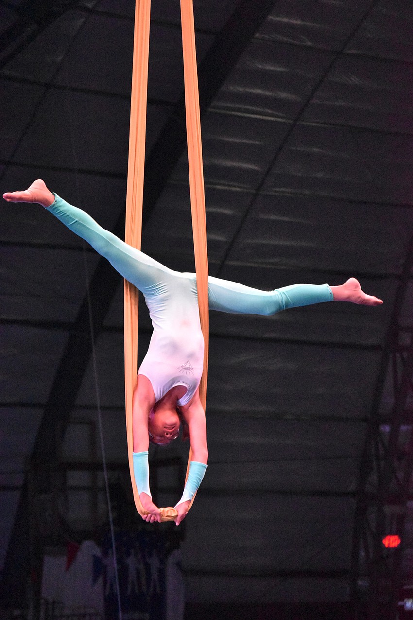 Grace Milton does a handstand on the Aerial Hammock.