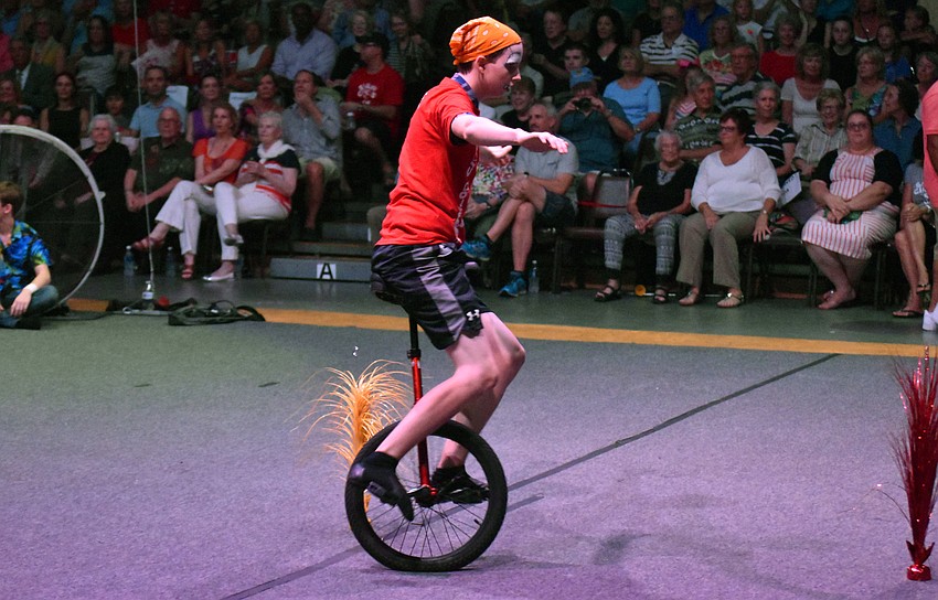 Colin Leonard unicycles around obstacles.