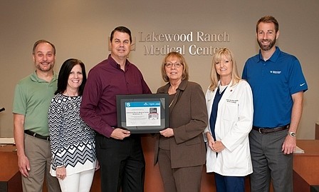 Lakewood Ranch Medical Center&#39;s Andrew Faber, Judy Young and Ralph Gonzalez, AHA and ASA Association&#39;sÂ Kathy Fenelon and LWRMC&#39;s Christine Gonzalez and Chris Loftus show off the award.