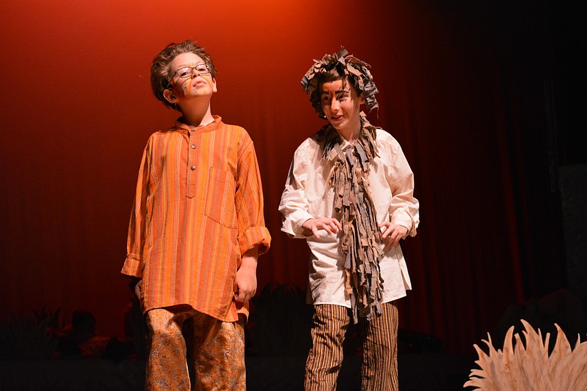 A young Simba (Ethan Hall) talks with his uncle, Scar (Connor Henning) and learns about an elephant graveyard he hopes to explore.