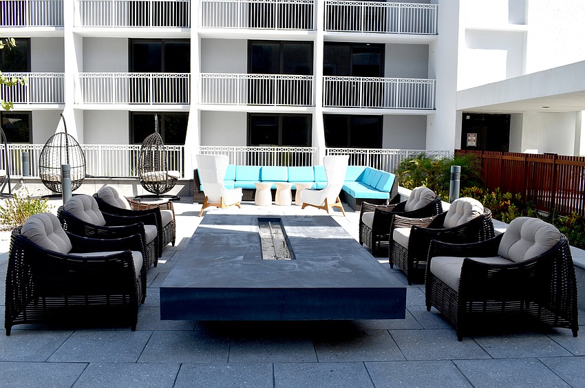 This outdoor seating space will include a fire pit.