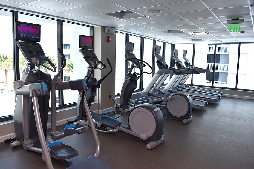 The fitness center is open 24/7 and offers views of the Gulf of Mexico and resort infinity pool.