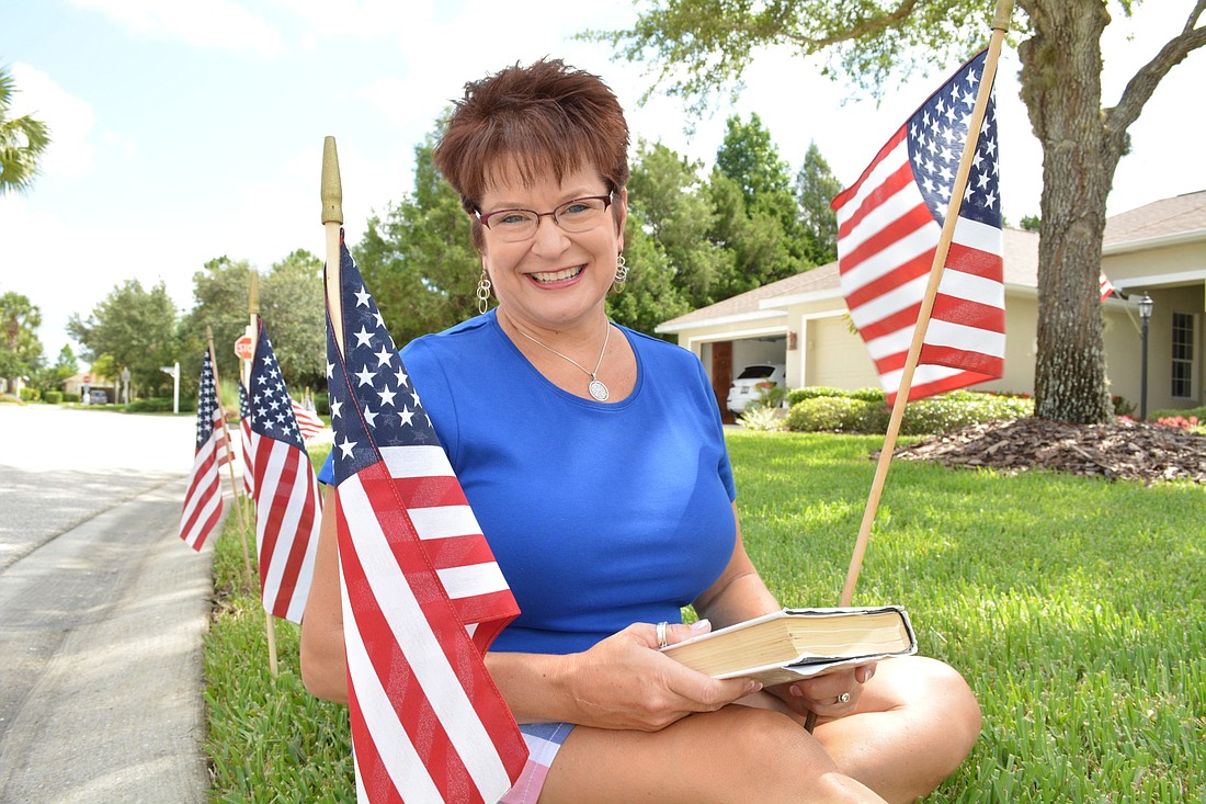 Every patriotic holiday, Linda Tradler puts out about 400 American flags. She started the tradition with about 40 flags in New Jersey.