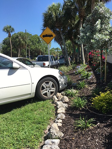 At Siesta Estates on Memorial Day weekend, people parked on property the community recently paid $16,000 to landscape. Photo courtesy Lori Jasper.