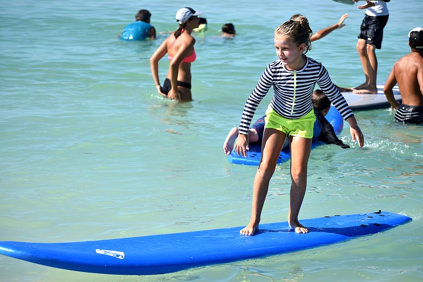 Mia Freeman surfs her way onto shore.