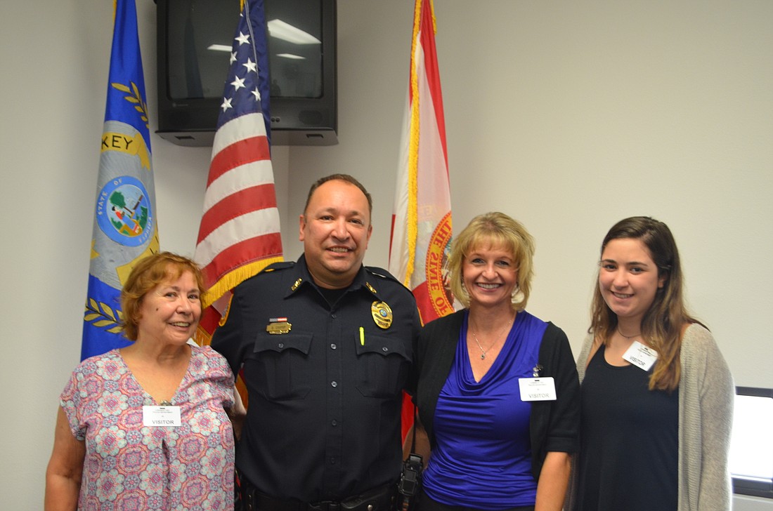 Sergeant Dave Cooper with (from right) Maureen Cooper (mother), Mirka Sidlo (girlfriend) and Bianca Cooper (daughter).