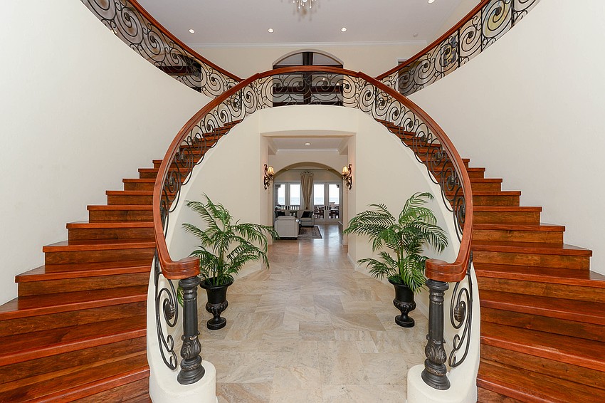 Villa Sena offers  a grand, double-Mahogany staircase with wave and seashell wrought iron railings.