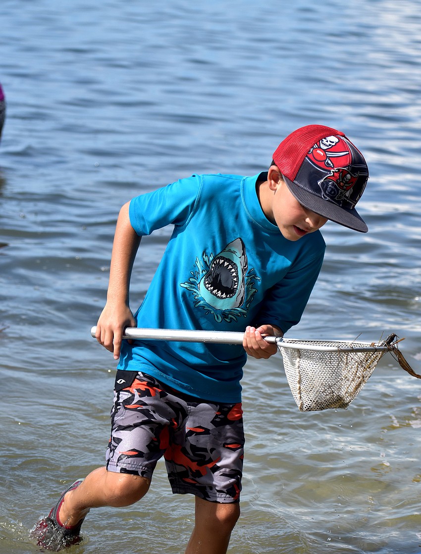 Reef Teffenhart checks his net for marine life.