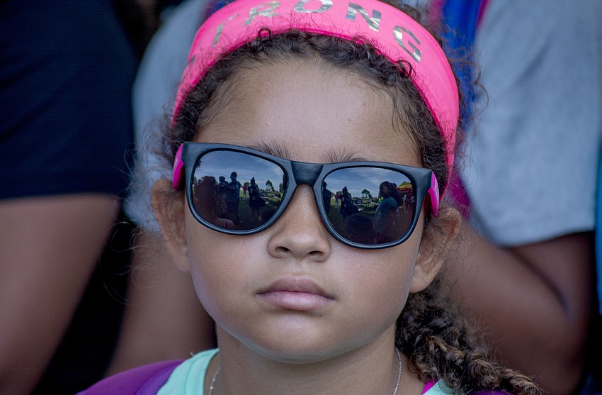 Onyx waits to compete in the Fit2Run fun run at the Boys and Girls Club. Each runner was given a Fit2Run pair of sunglasses.