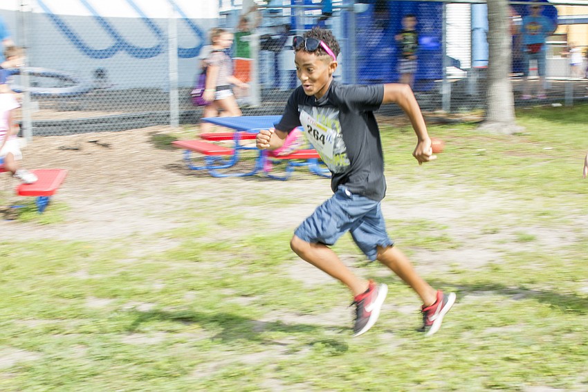 Jeremiah rounds the turn on his second lap during the Fit2Run fun run at Boys and Girls Club.