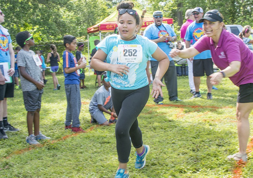 Ghita finishes one of her ten laps during the Fit2Run fun run at Boys and Girls Club.
