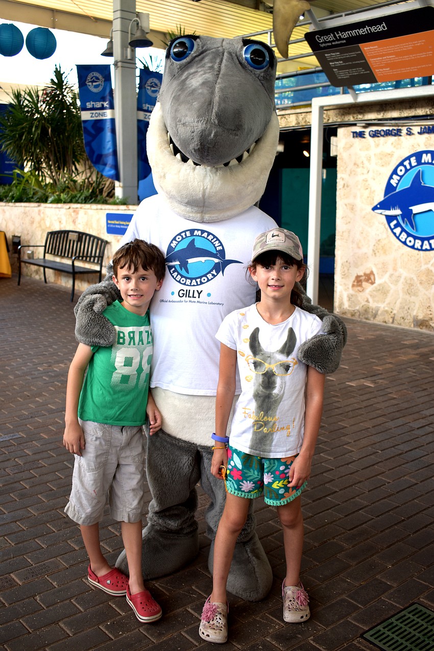 Charlie and Rose Rayner pose with Gilly the Shark