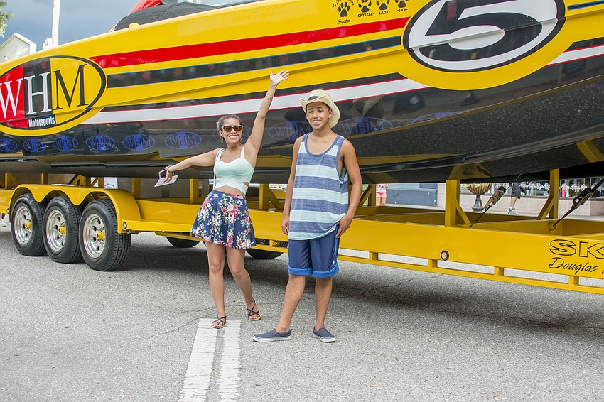 Stephanie Olivieri and Marc Olivieri pose in from of the WHM Motorsports boat