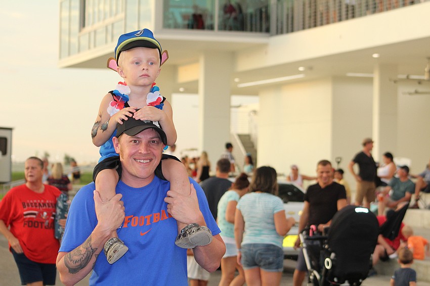 East County's Wesley Helm takes a ride on his dad, Mike Helm's shoulders.