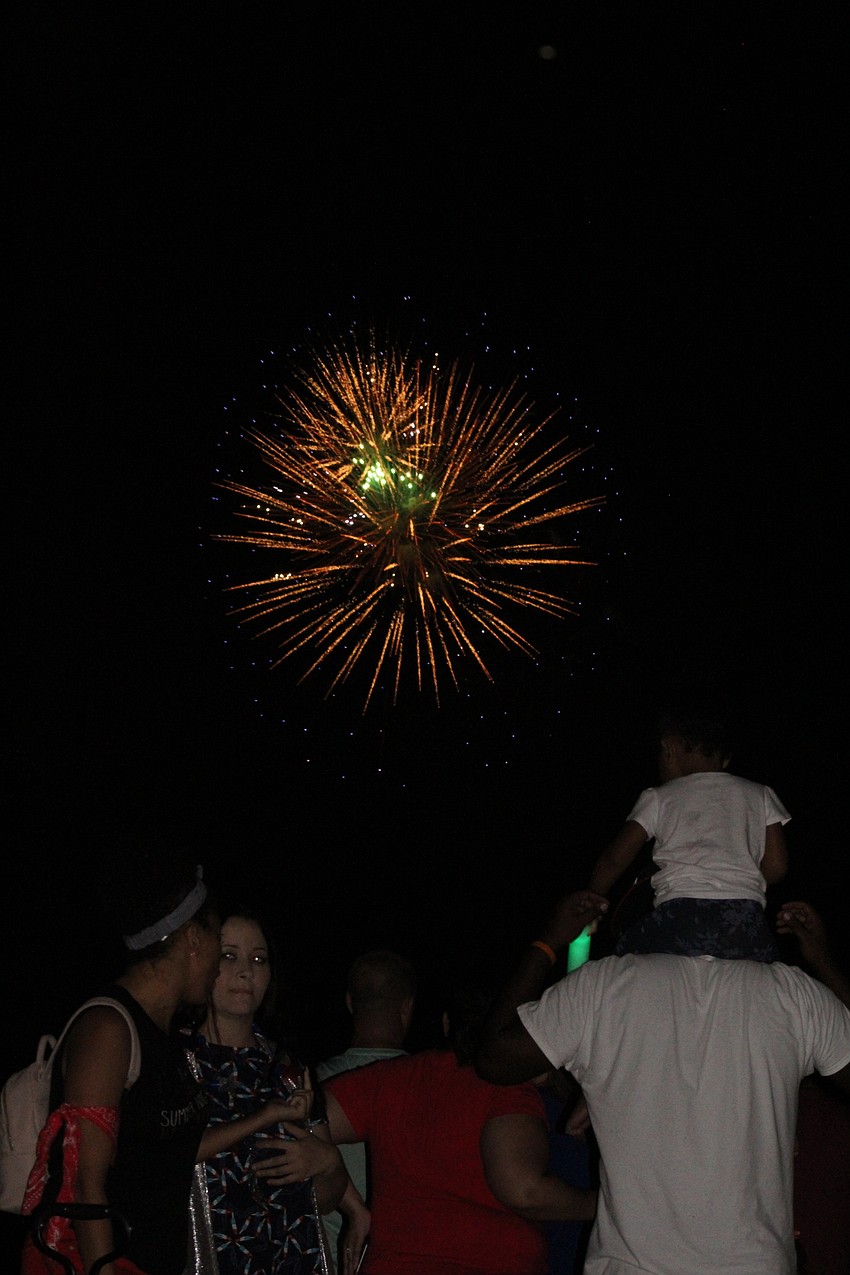 Spectators watch the fireworks show at Nathan Benderson Park.