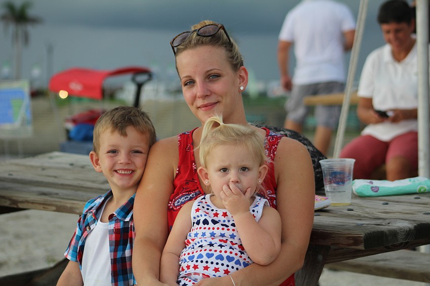 East County's Truce, Ashley and Amelia Seliger wait for darkness to fall so they can see fireworks.